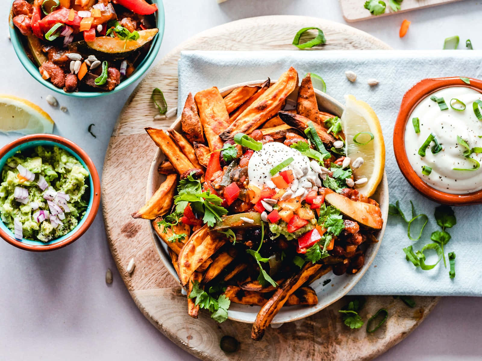 A Bowl Of Fries With A Bowl Of Hummus And A Bowl Of Salsa Wallpaper