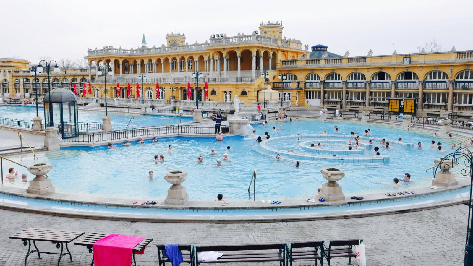 A Large Pool With People In It Wallpaper