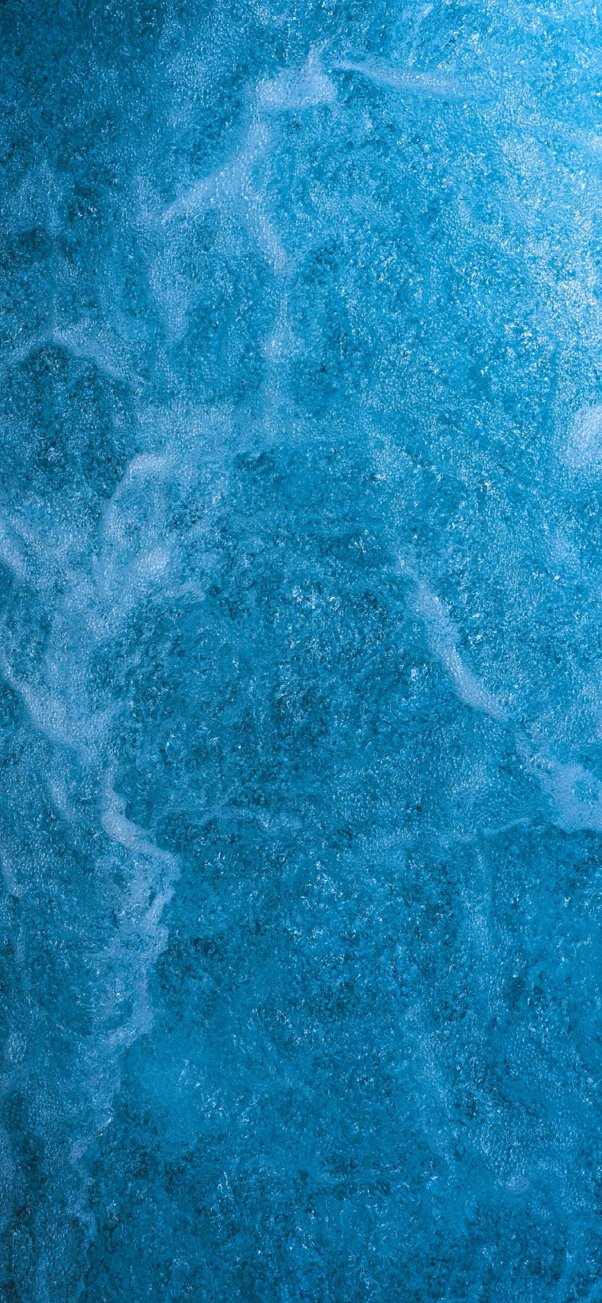 A Light Blue Phone With Fizzy Texture Wallpaper