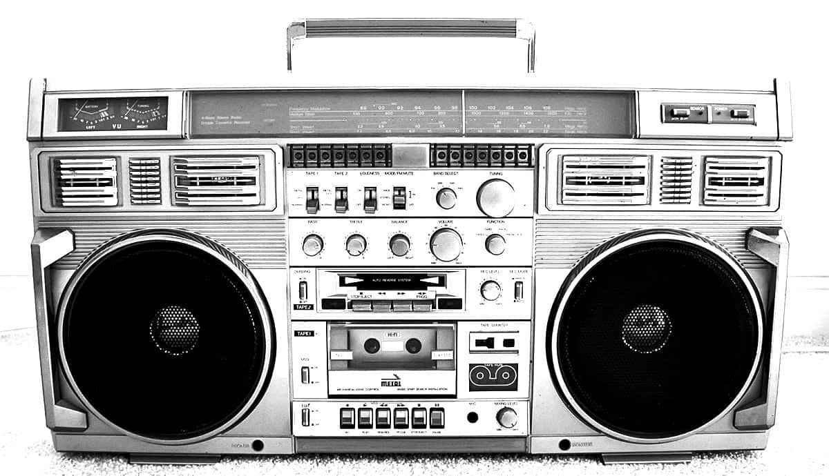 A Retro Boombox On A Graffiti Backdrop Wallpaper