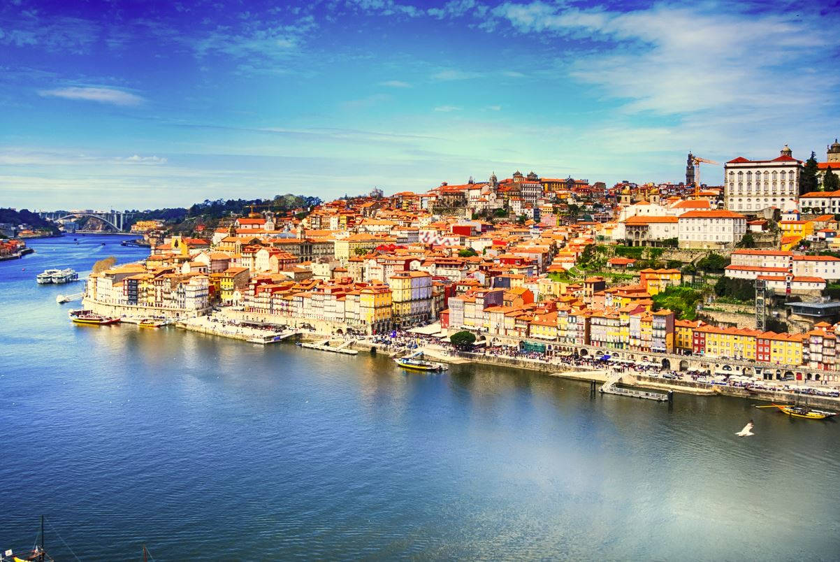 A Scenic View Of Lisbon Village By The Ocean Wallpaper