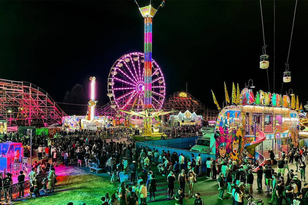 A Vibrant Bird’s Eye View Of A Bustling Fair Wallpaper