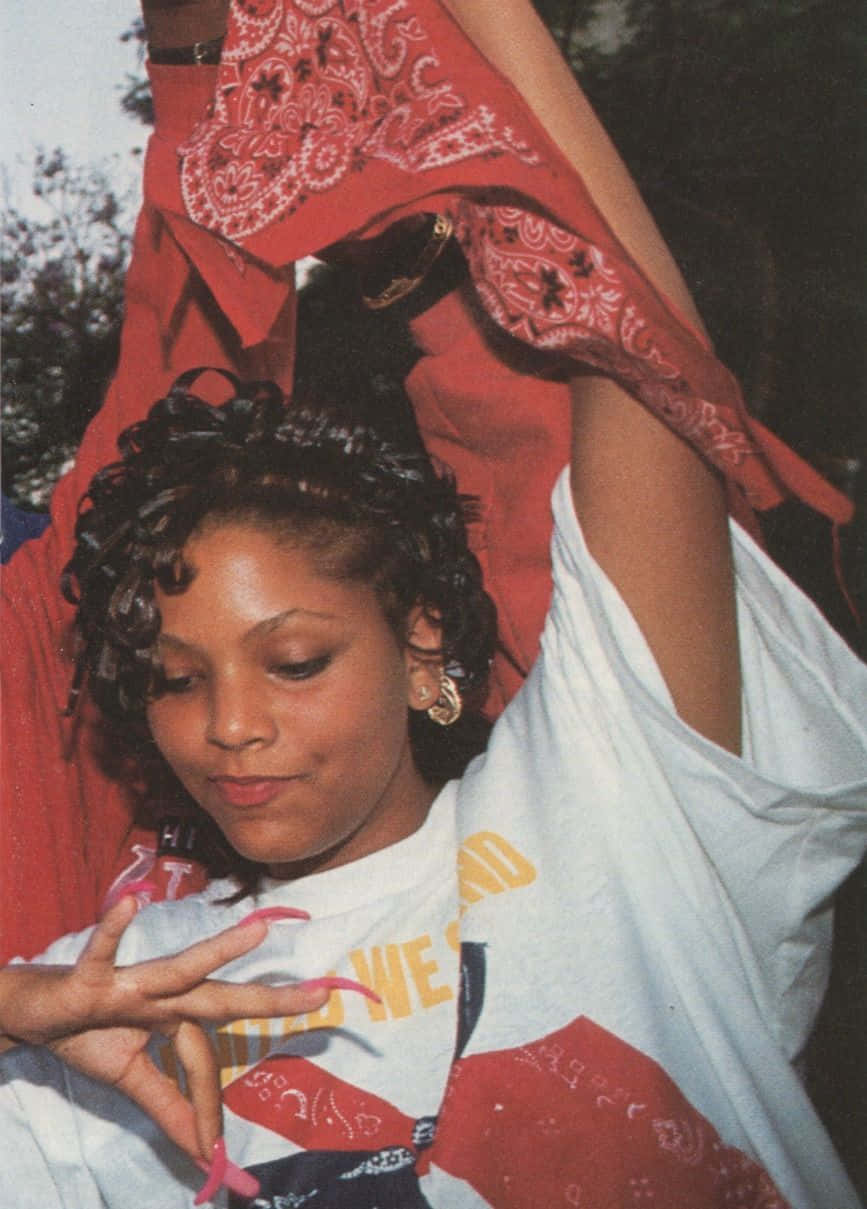 A Woman Holding A Red Bandana Wallpaper