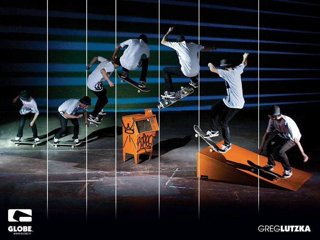 Adrenaline Rush! Skateboarder Performing A Stunning Trick Wallpaper