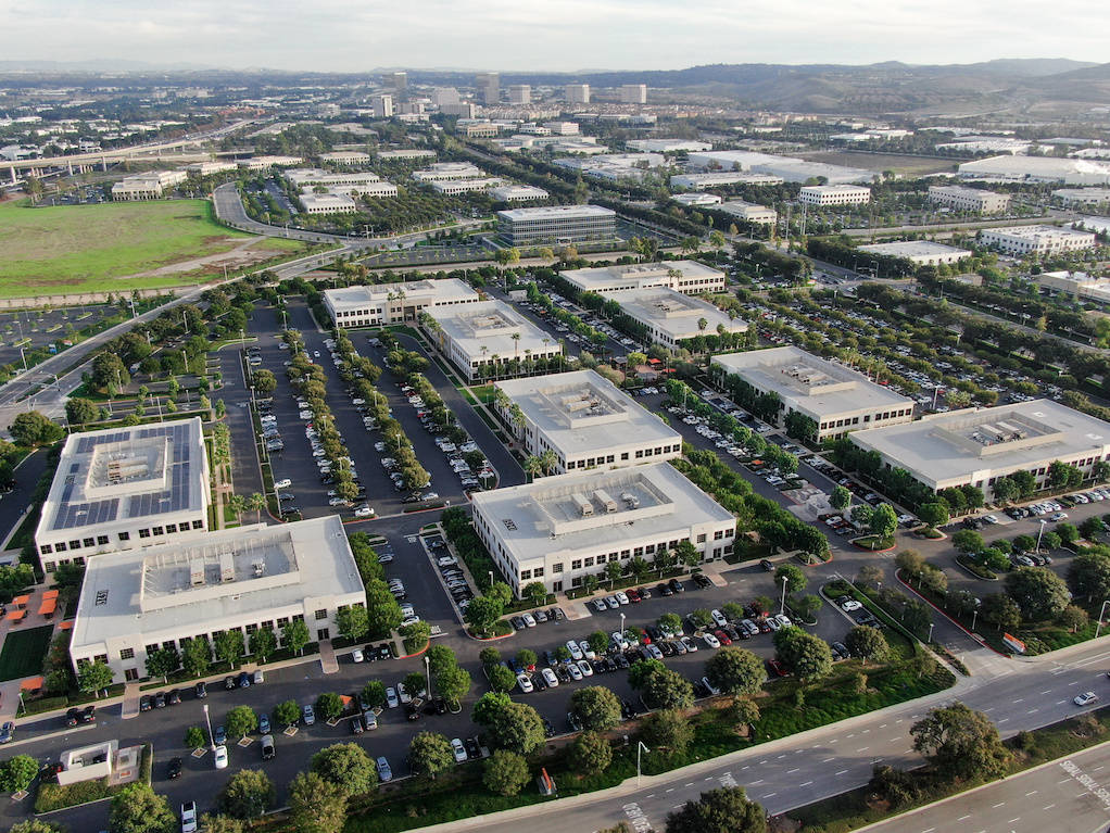 Aerial View Of Buildings With Parking Lots Wallpaper