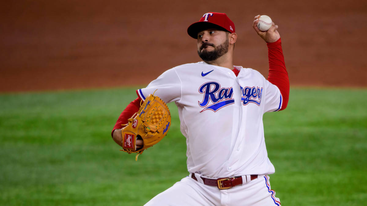 Agile Martin Perez In Mid-action On The Baseball Field Wallpaper