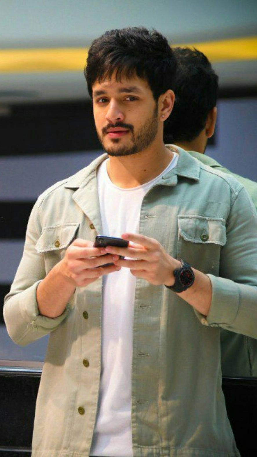 Akhil Akkineni With Phone Wallpaper