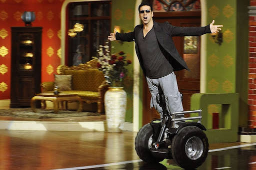 Akshay Kumar Riding Segway Scooter Wallpaper