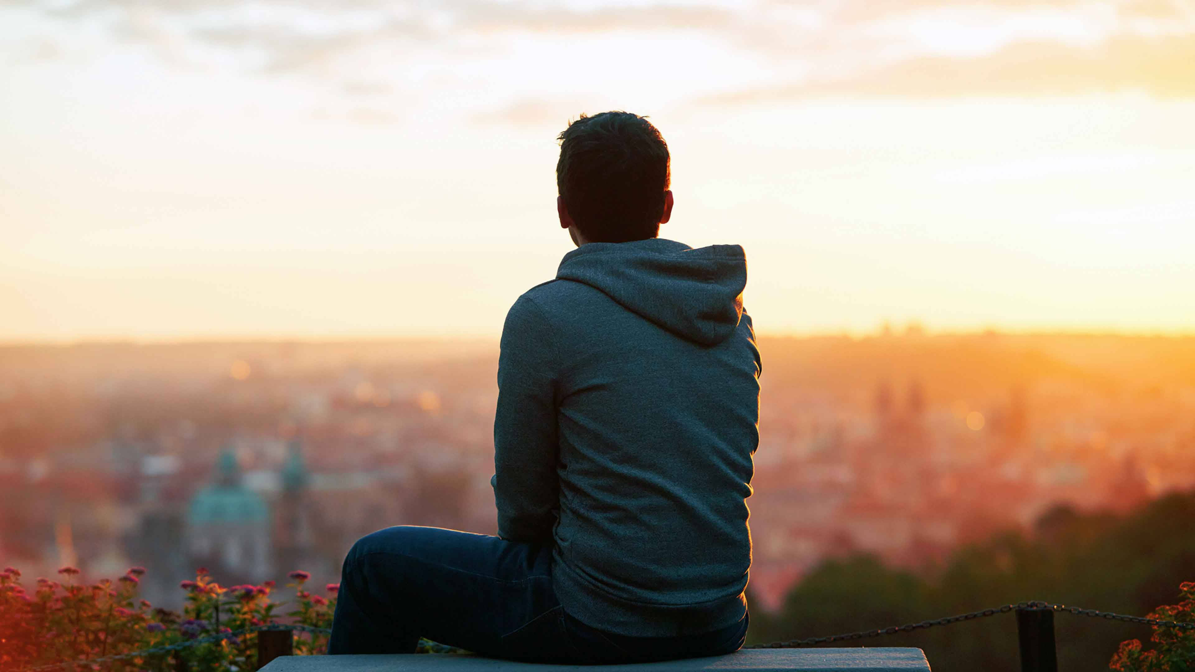 Alone Boy With Orange Skyline Wallpaper