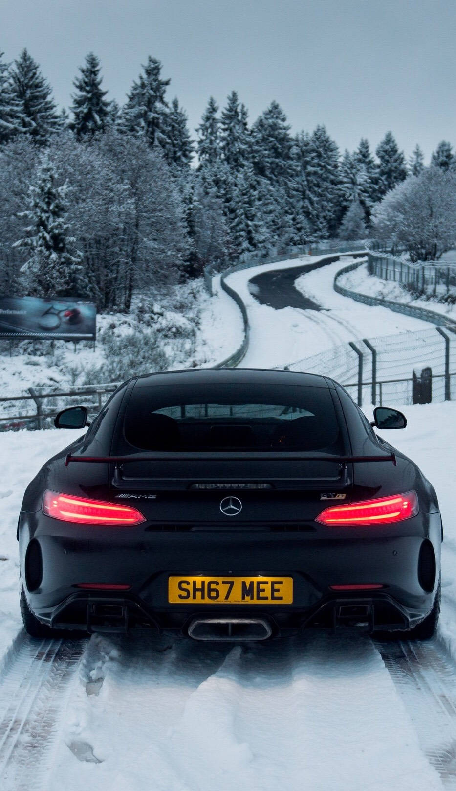 Amg Driving Through Snow Wallpaper