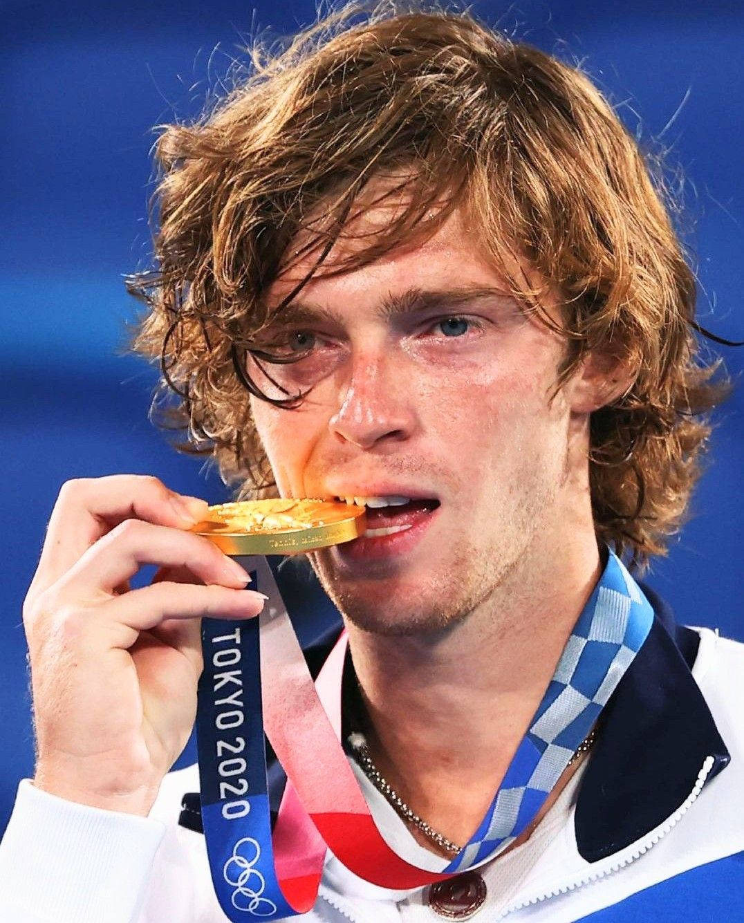 Andrey Rublev Biting A Medal Wallpaper