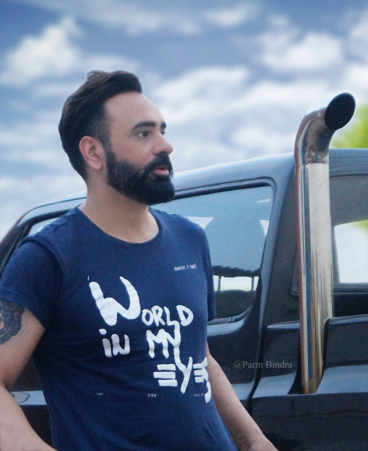 Babbu Maan Stylishly Poised In Casual Tee Wallpaper