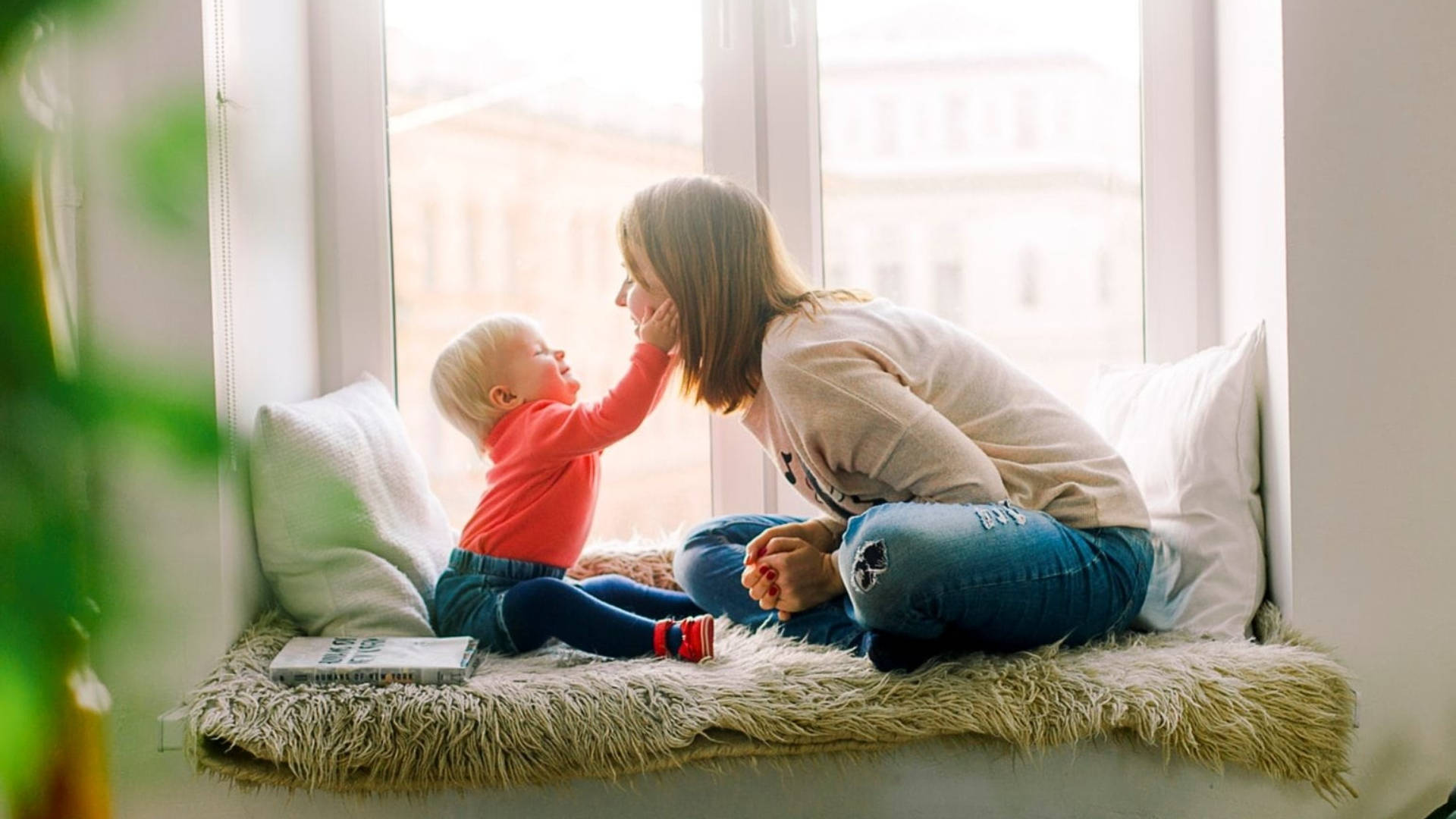 Baby Love Holding Mother's Cheek Wallpaper