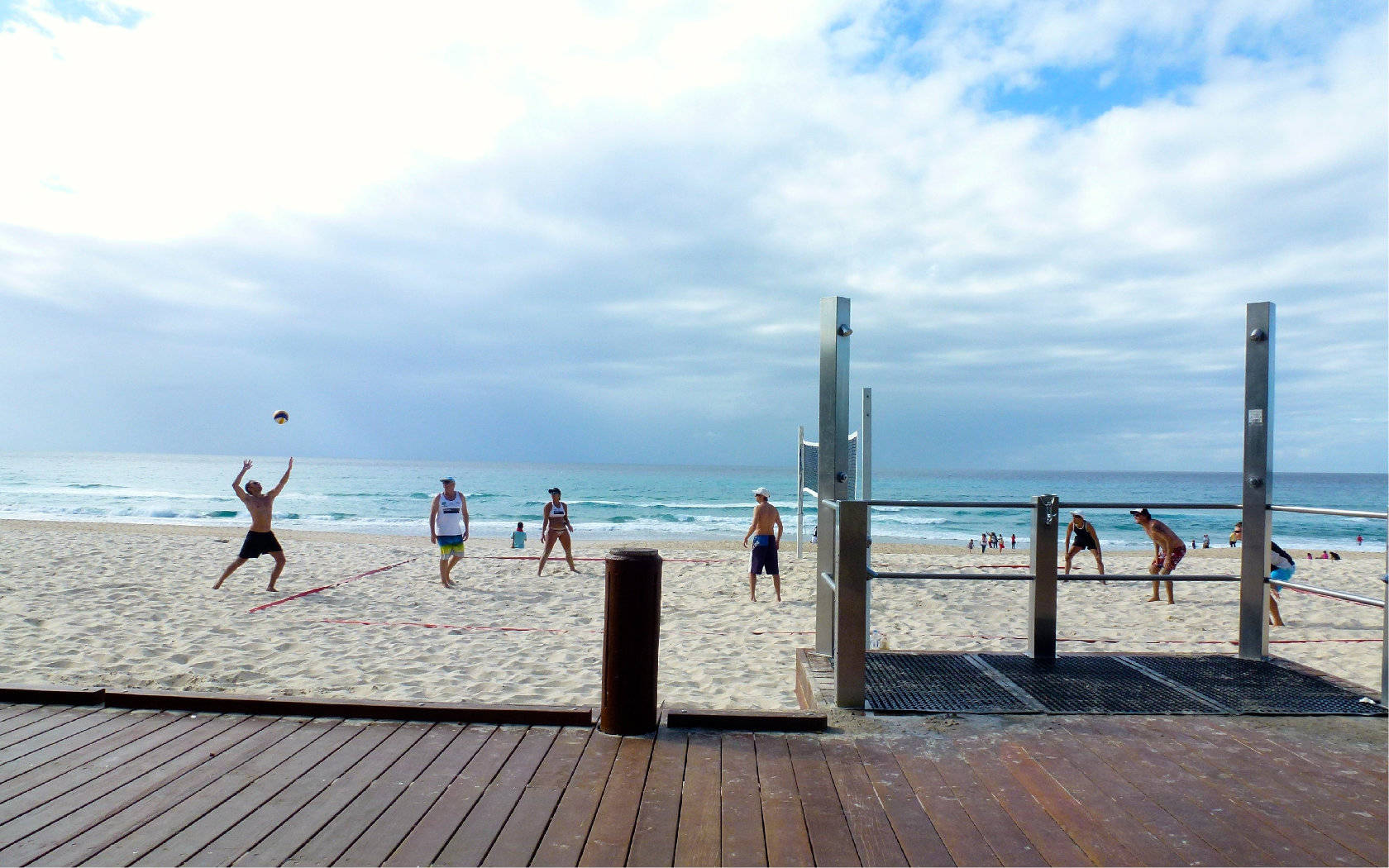 Beach Volleyball Near Wooden Deck Wallpaper