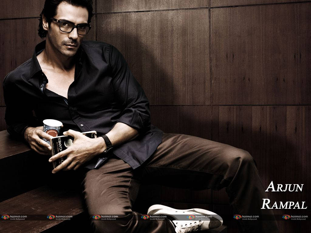 Bollywood Star Arjun Rampal In Pensive Gaze Wallpaper