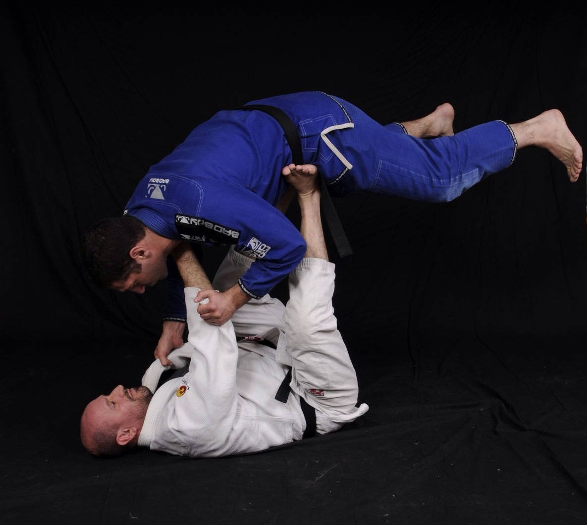 Brazilian Jiu-jitsu Practitioner Exhibiting The Mount Position Wallpaper