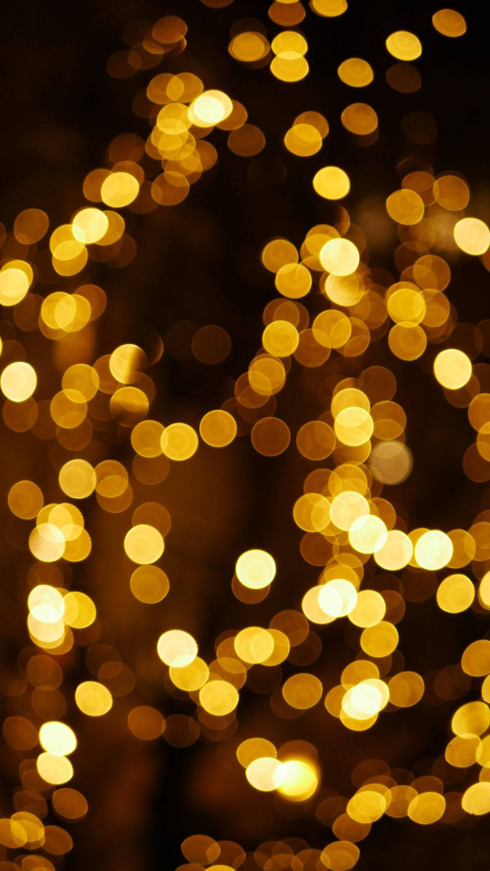 Brighten Up The Holidays With Yellow Christmas Lights Wallpaper