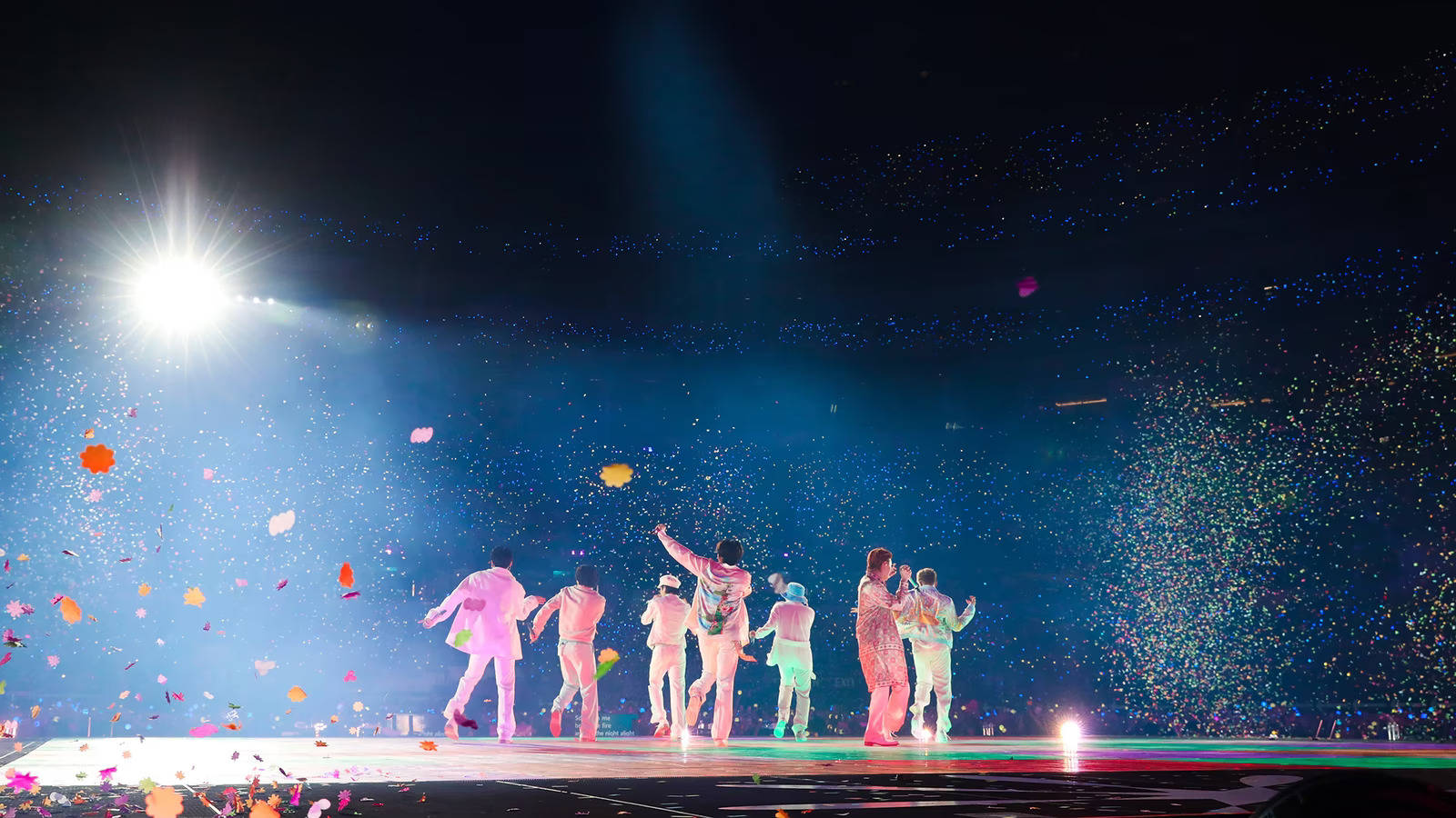 Bts Concert In Their Dynamite Performance Wallpaper