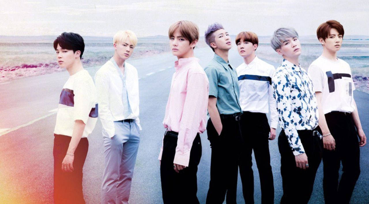 Bts Group Photo On The Road Wallpaper