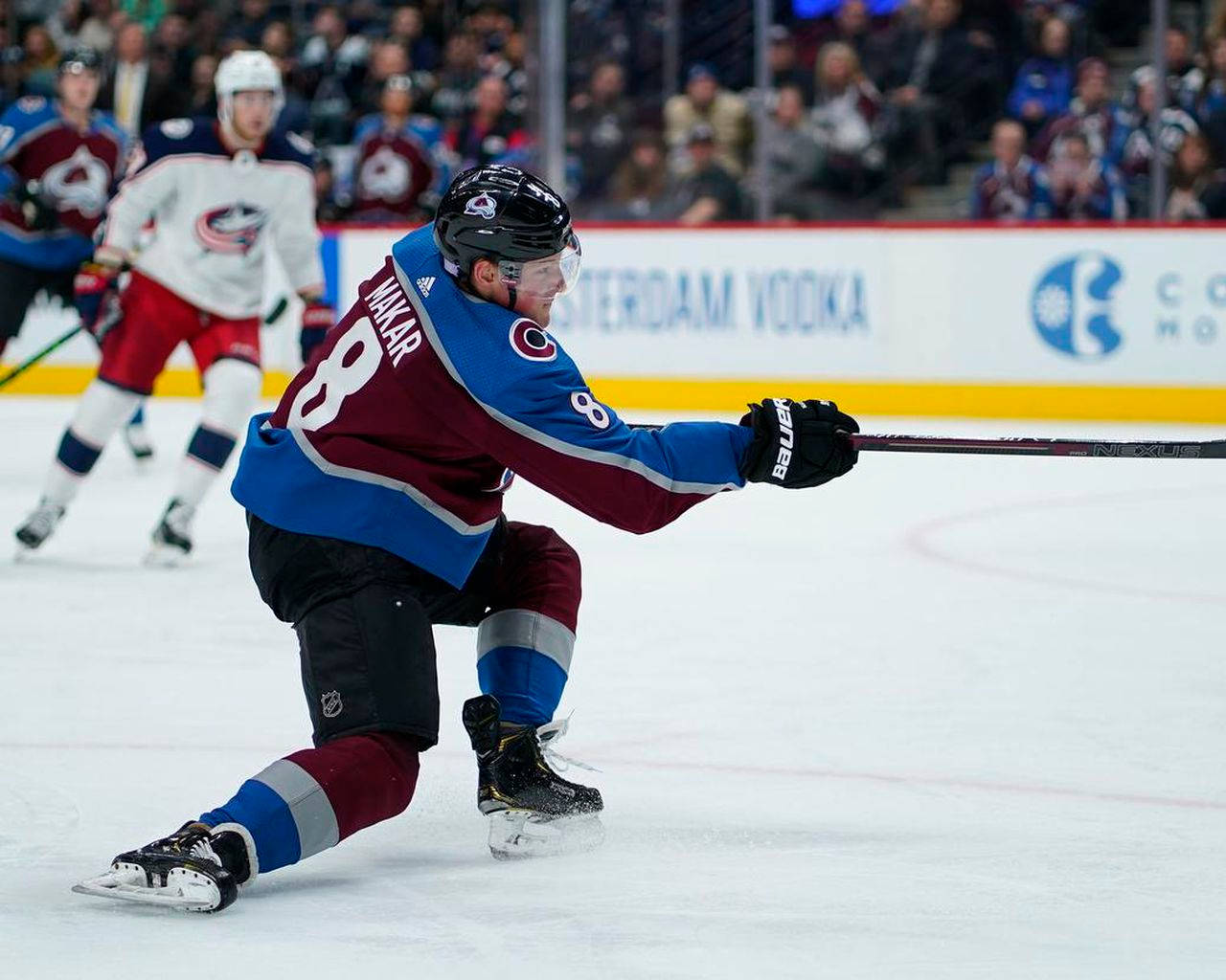 Cale Makar In Action During A Hockey Match Wallpaper