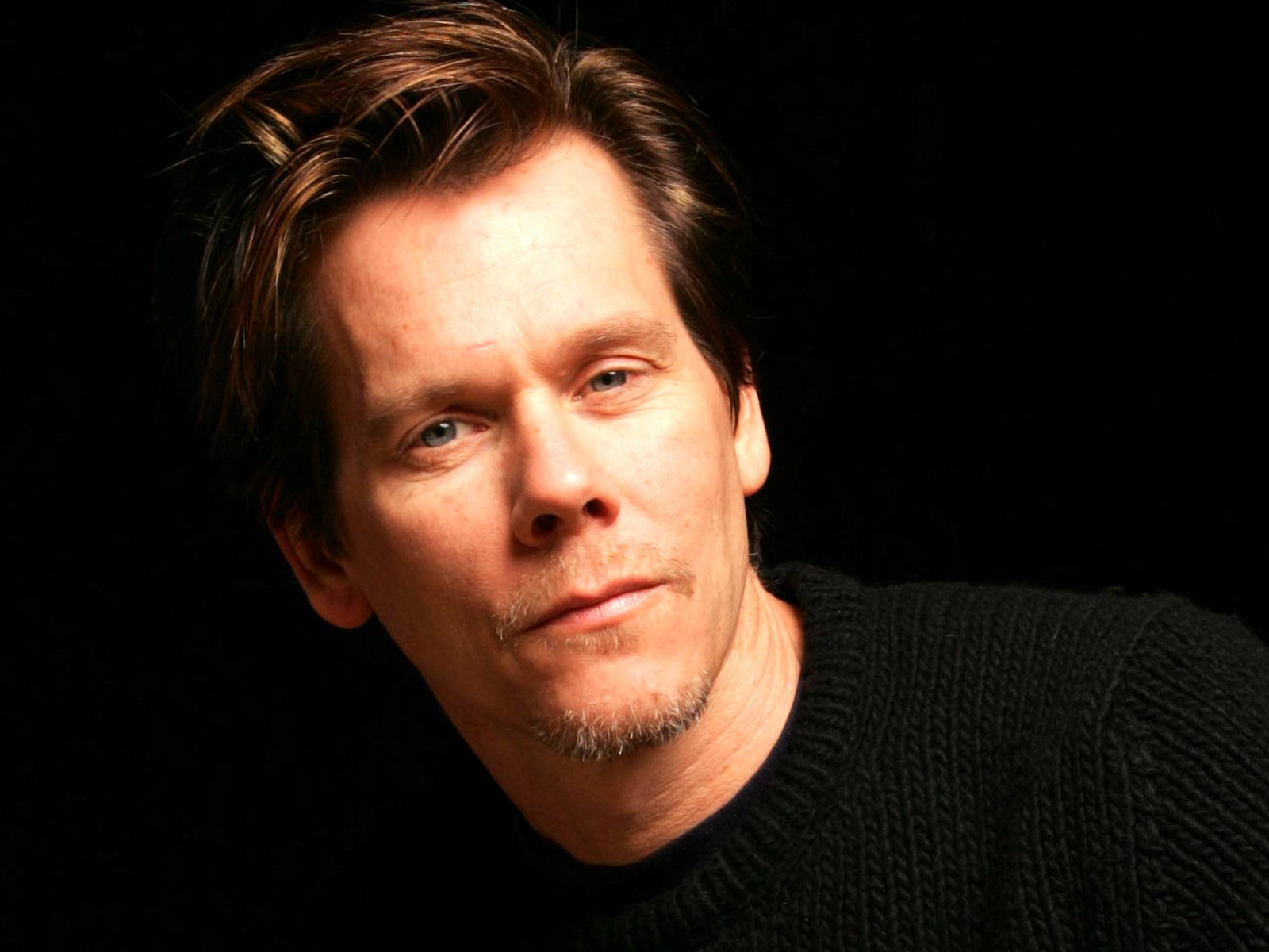 Caption: Hollywood Veteran Kevin Bacon In A Monochrome Headshot Wallpaper