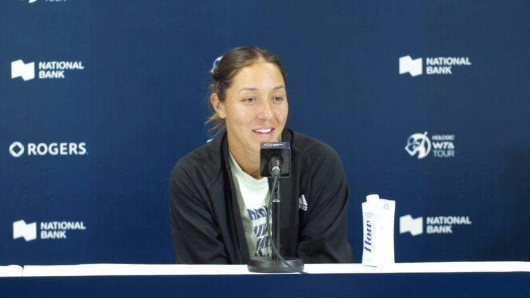 Caption: Jessica Pegula Answering Questions During A Press Conference Wallpaper