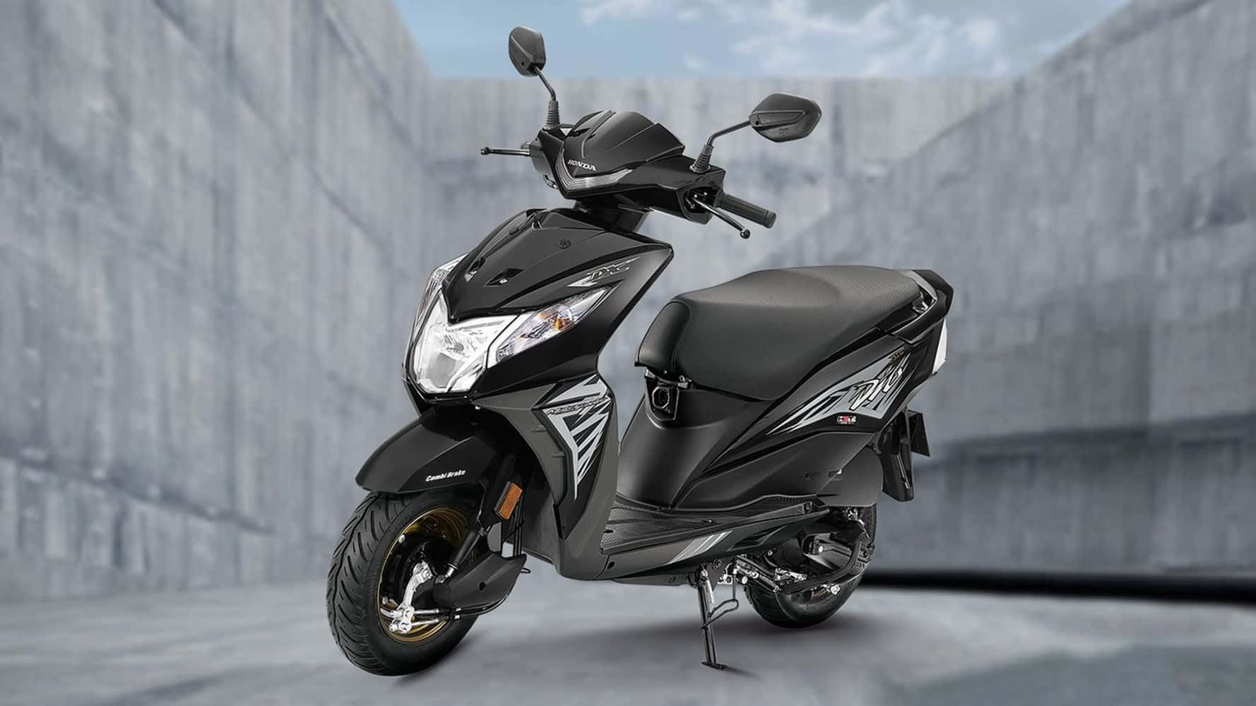 Caption: Sleek And Stylish Honda Dio Bike Wallpaper