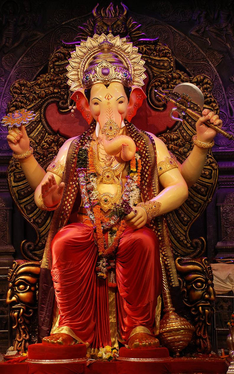 Caption: Splendor Of Lalbaugcha Raja In Red Wallpaper