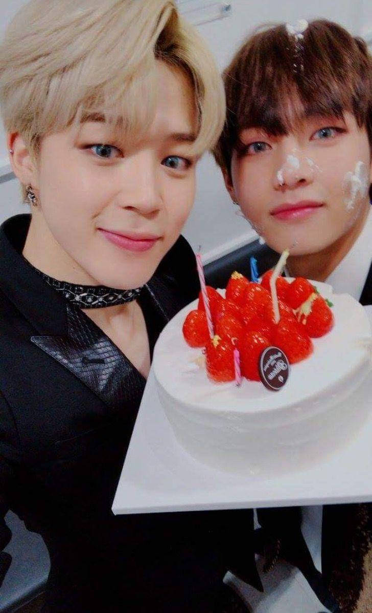 Captivating Moment Between Vmin Enjoying A Cake Together Wallpaper