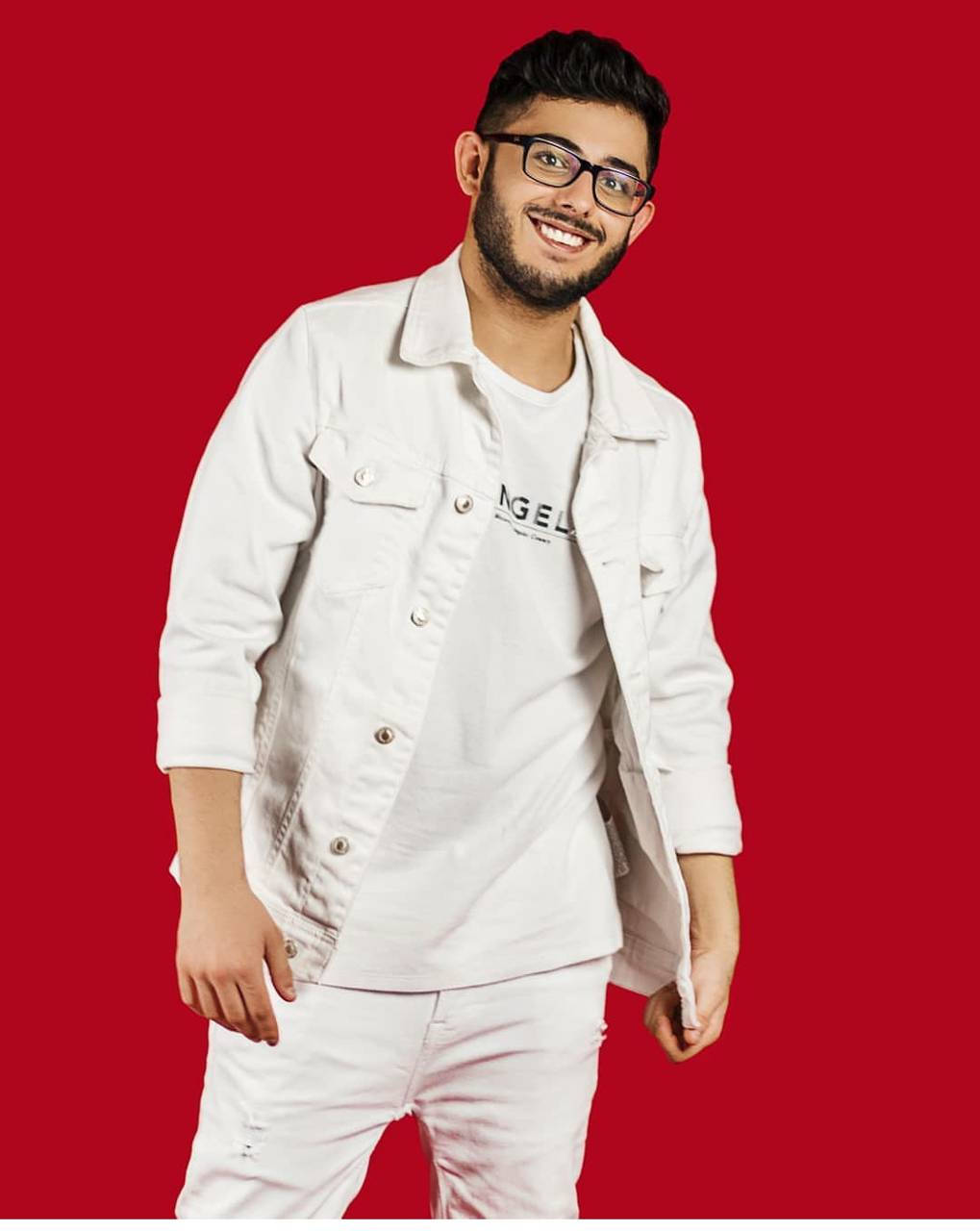 Carryminati In Red Background Wallpaper