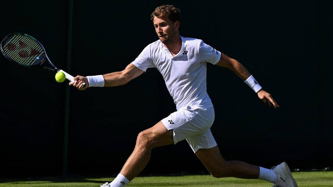 Casper Ruud In Long Strides On The Tennis Court Wallpaper