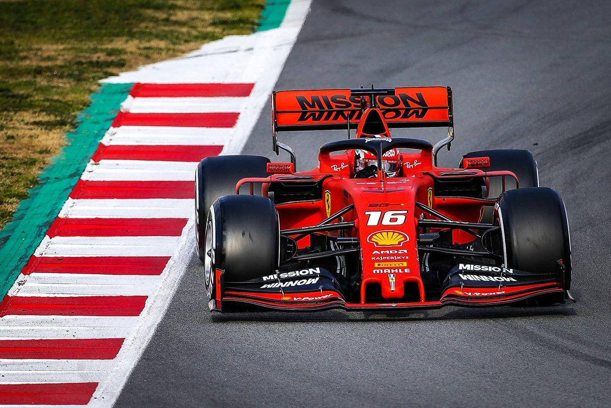 Charles Leclerc Racing Near Curb Wallpaper