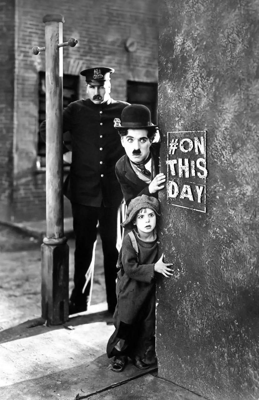 Charlie Chaplin Entertains A Young Fan. Wallpaper