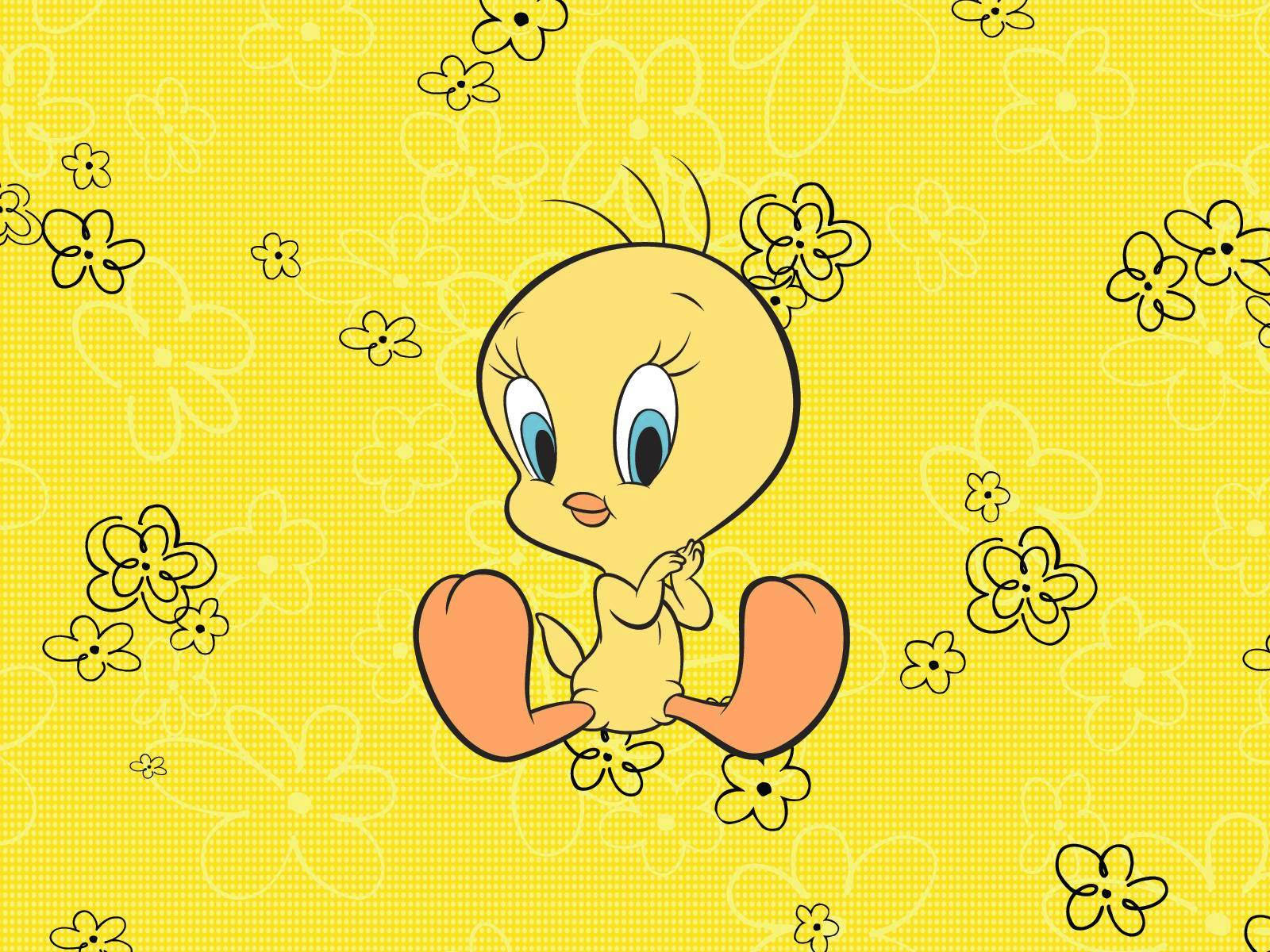 Cheerful Tweety In Vibrant Yellow Floral Background Wallpaper