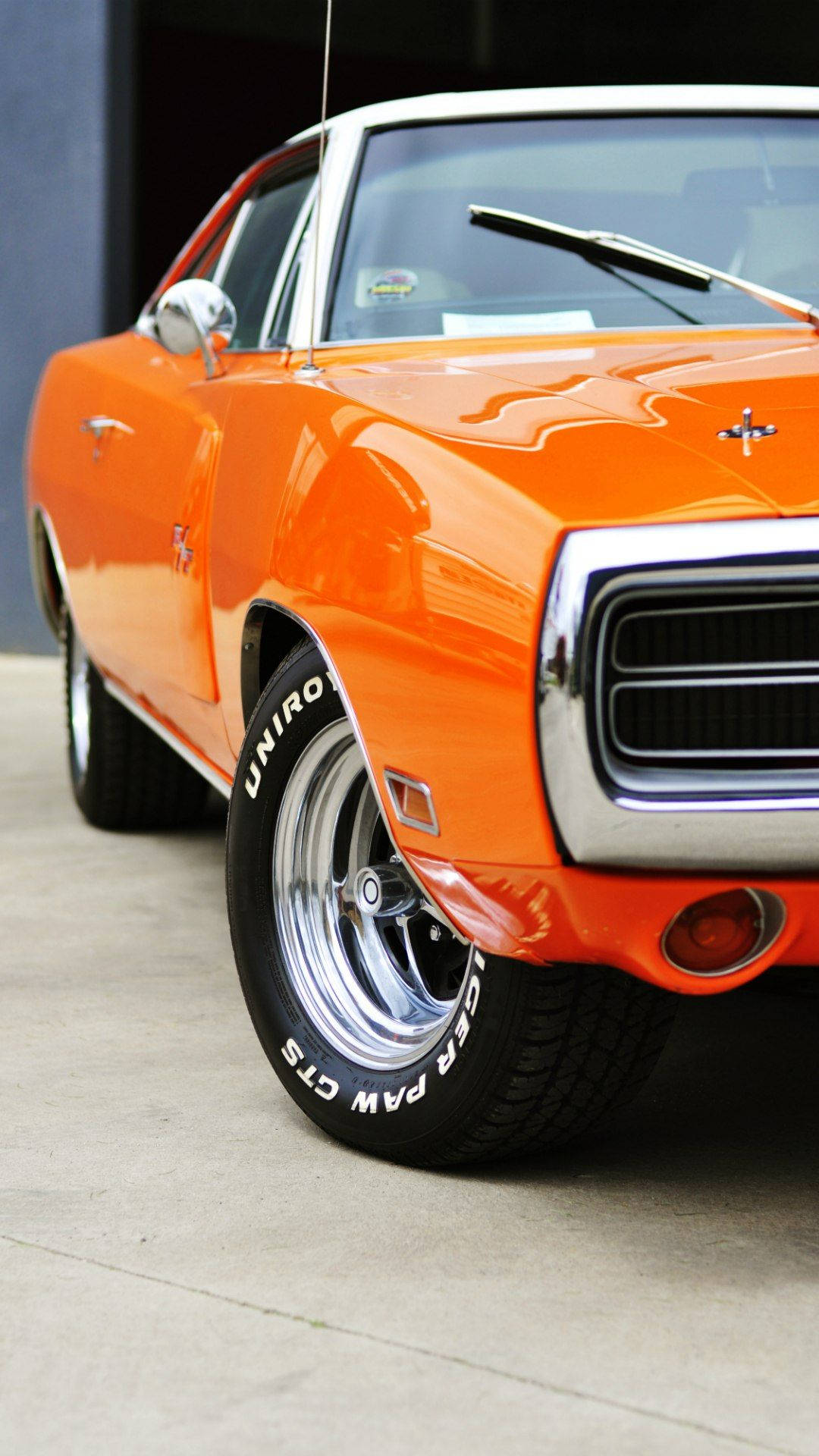 Classy Vintage Orange Colored Car With Phone Wallpaper