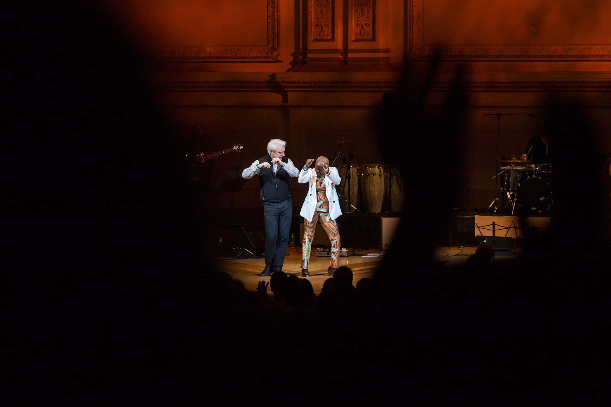 Closeup Of Talking-heads On A Brightly Lit Stage Wallpaper