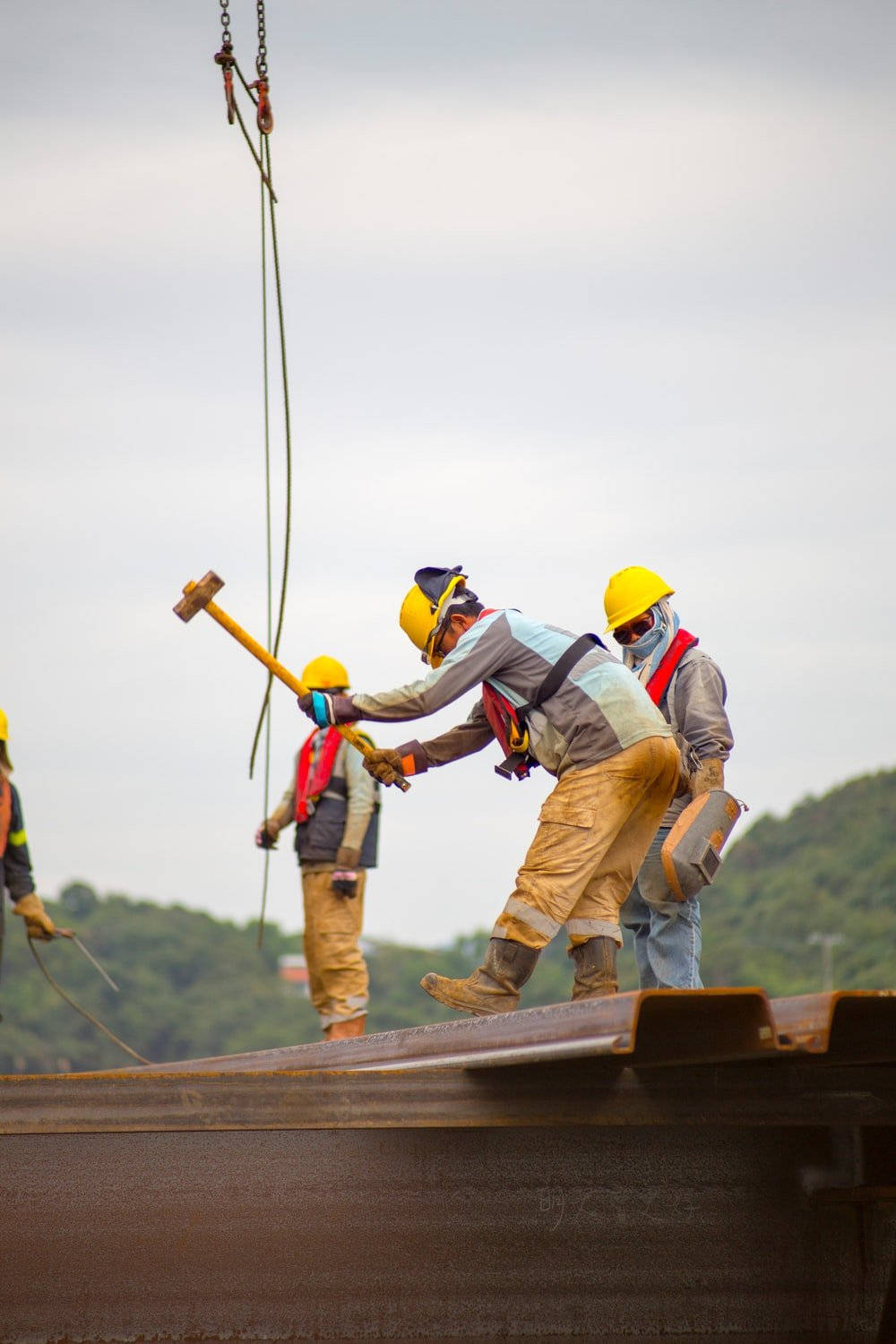 Construction Worker Hit The Iron Girder Wallpaper