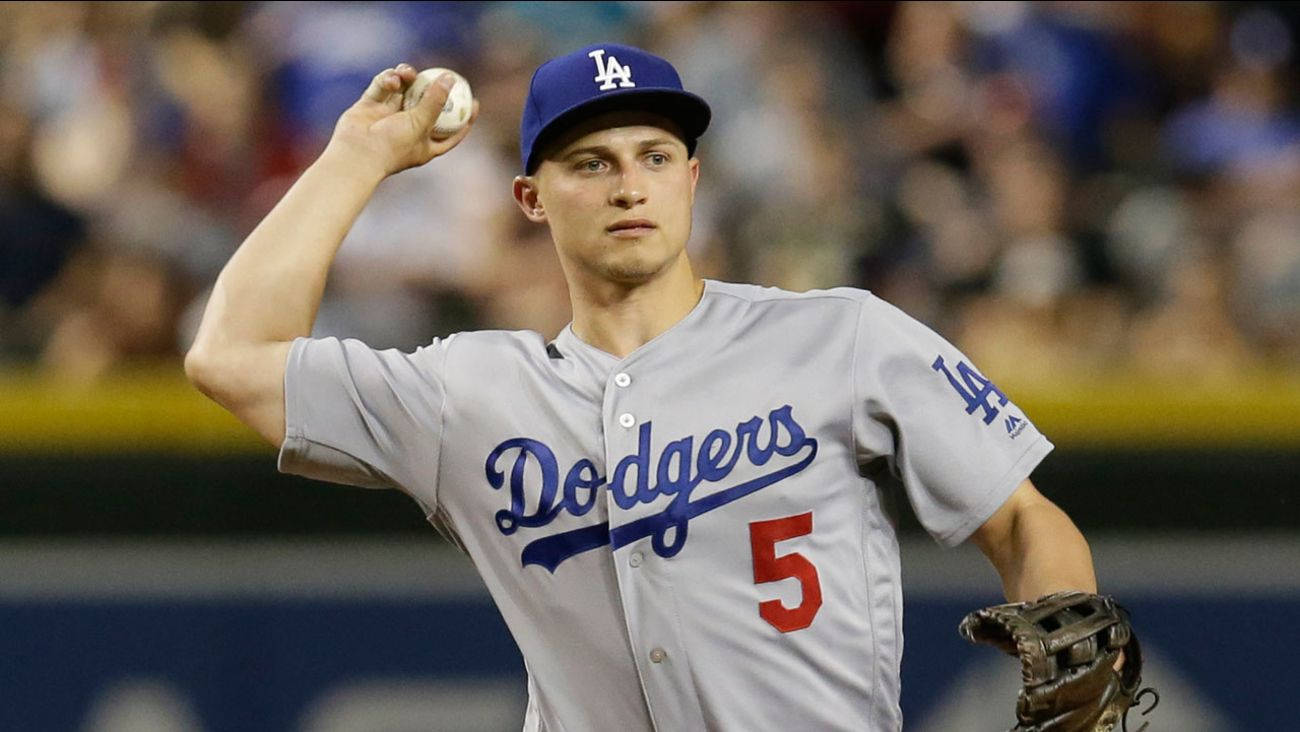 Corey Seager Raising Hand To Throw Ball Wallpaper