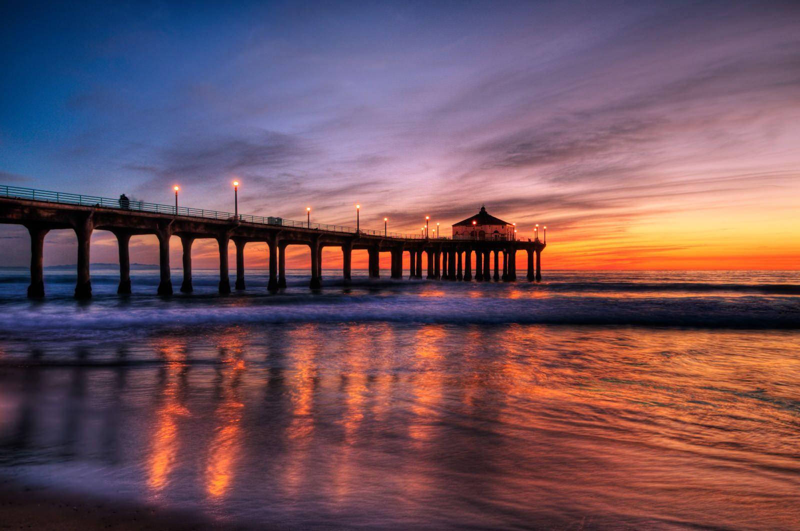 Cottage On Beach During Sunset Wallpaper