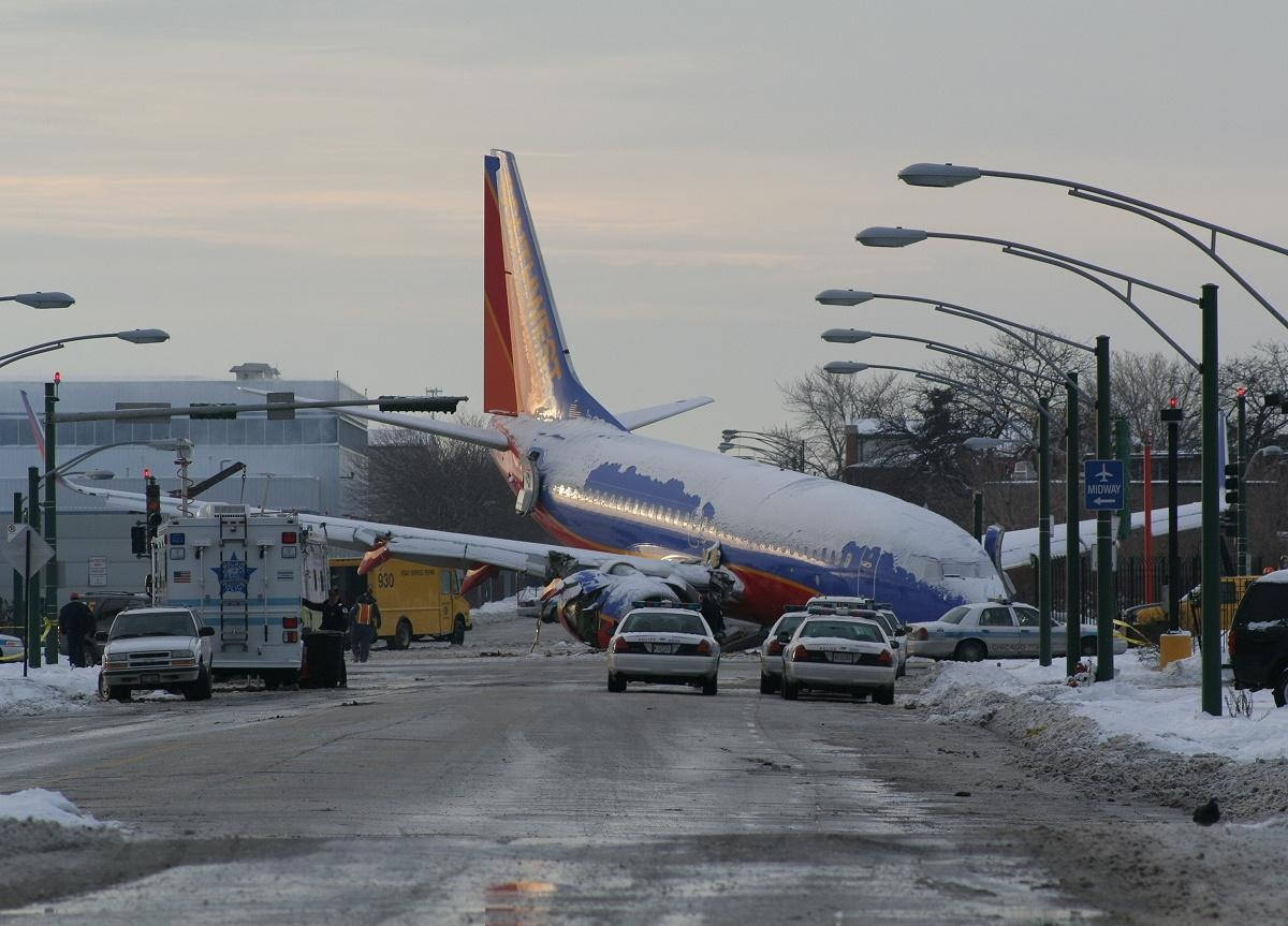 Crashed Southwest Plane On City Road Wallpaper