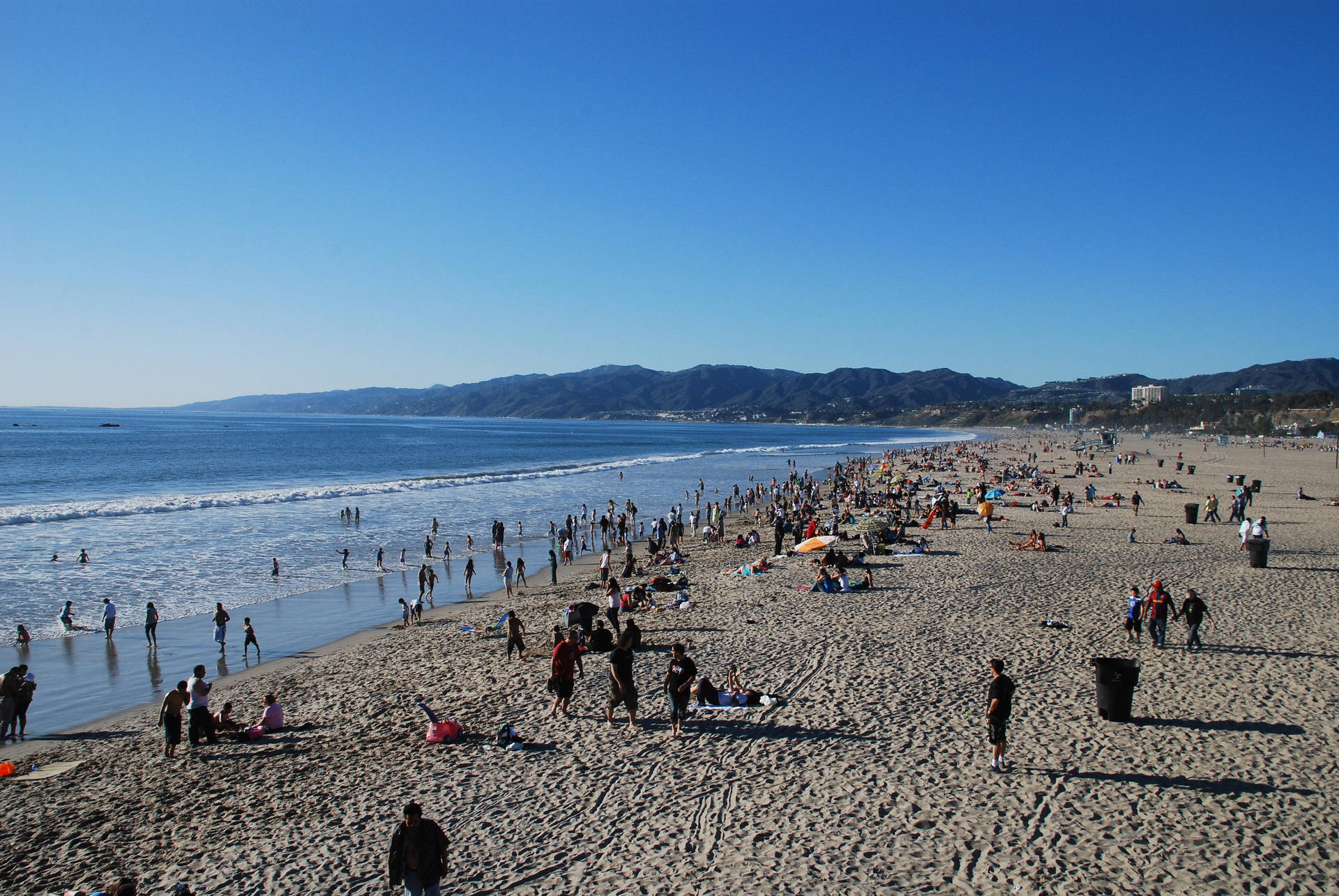 Crowd Of People At Malibu Beach Wallpaper