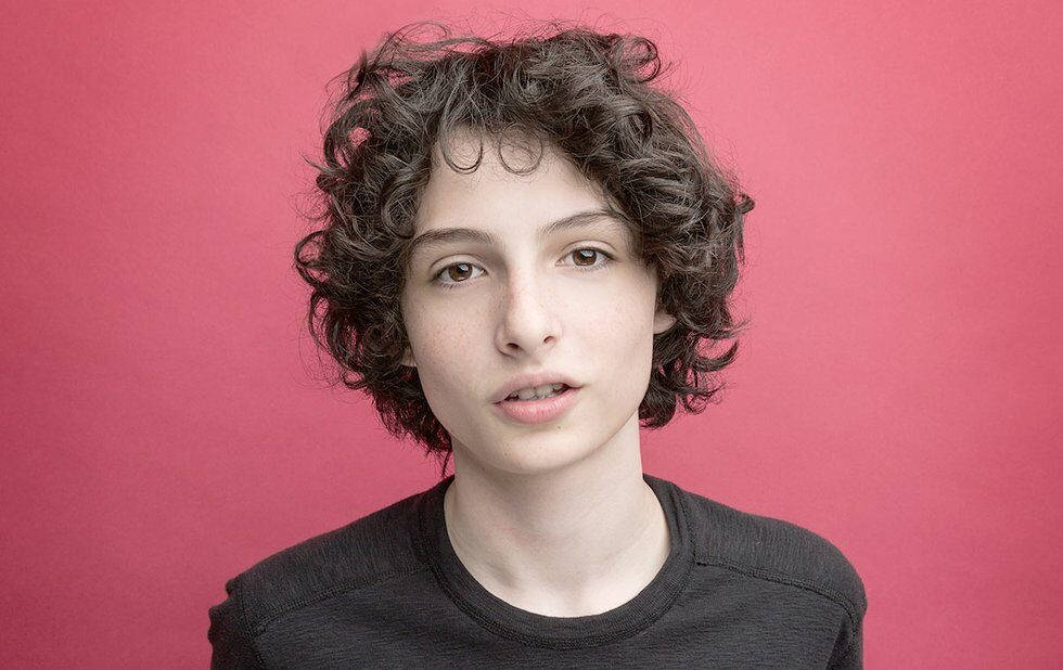 Curly-haired Finn Wolfhard Wallpaper