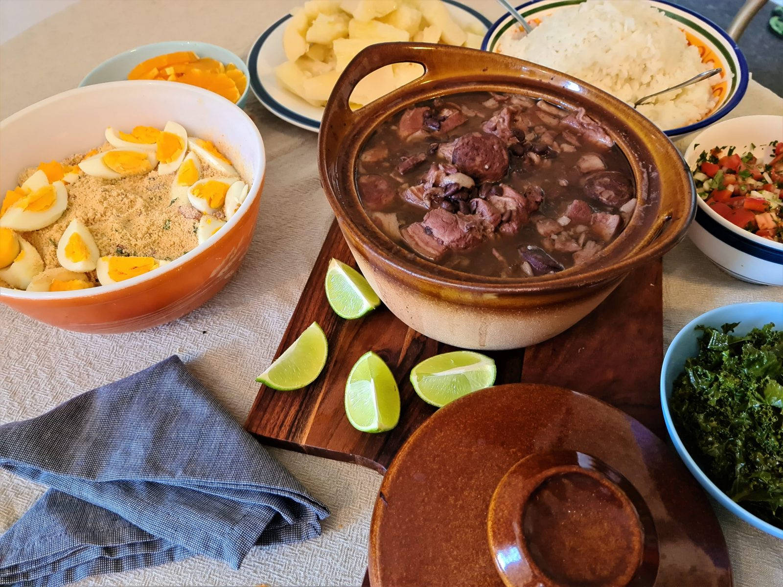 Delectable Brazilian Feijoada With Flavorful Garnishings Wallpaper