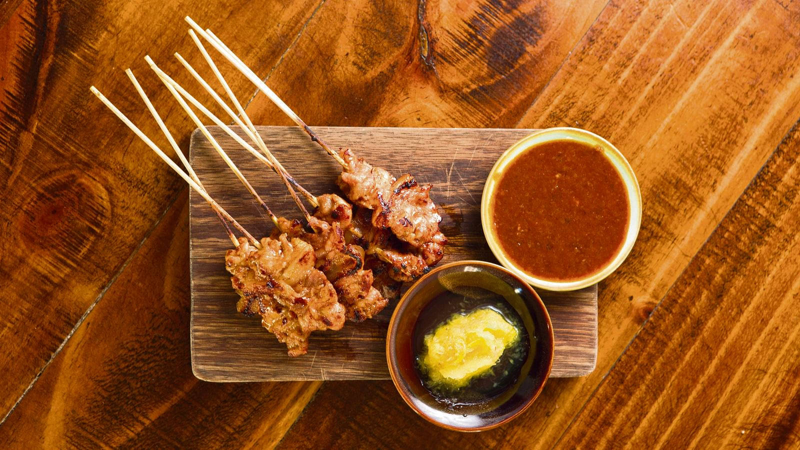 Delectable Chicken Satay Skewers With Red Sauce Wallpaper