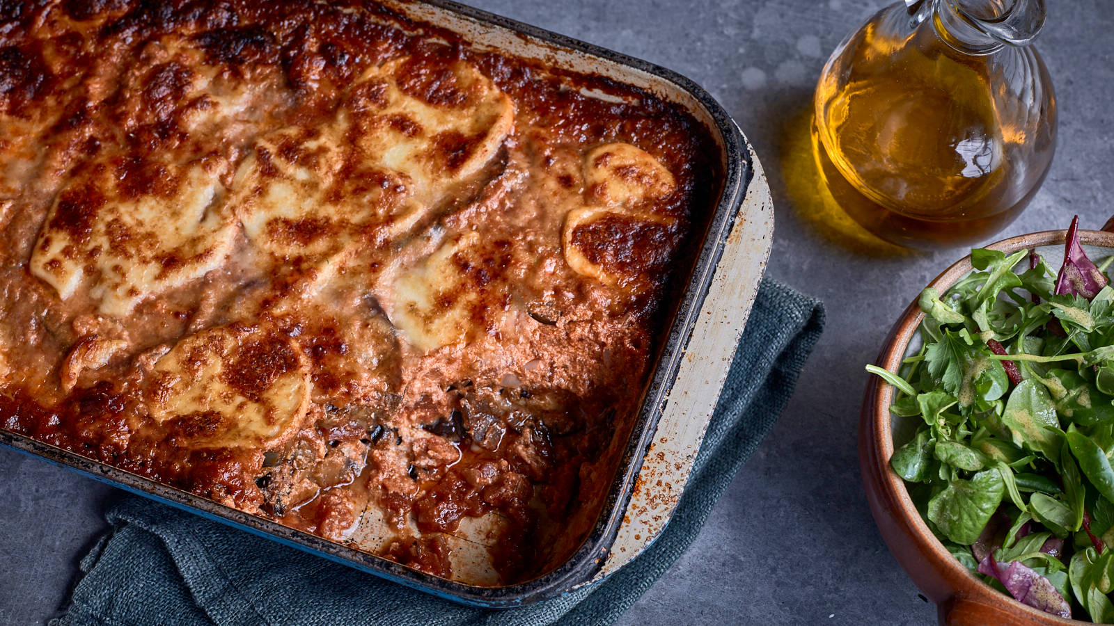 Delicious Aubergine Parmigiana With Fresh Green Salad Wallpaper