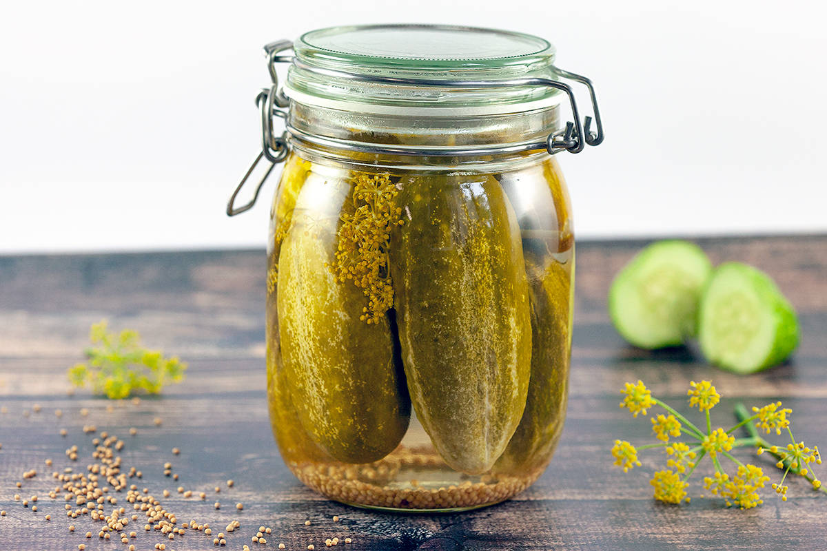 Delicious Pickles Resting In An Airtight Glass Jar Wallpaper