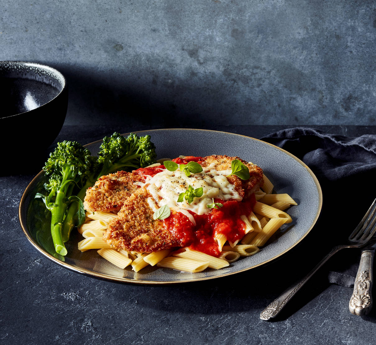 Delightfully Cheesy Pork Parmigiana With Arrabbiata Sauce And Penne Pasta Wallpaper