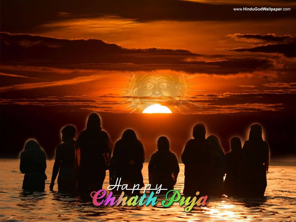 Devotees Celebrating Chhath Puja At Sunset Wallpaper