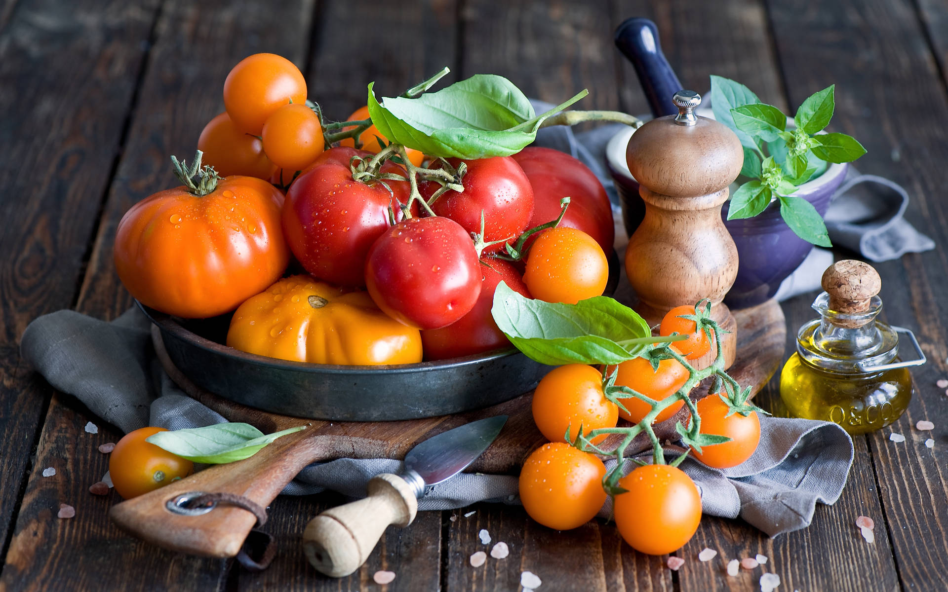 Different Tomato Fruits On Wooden Table Wallpaper