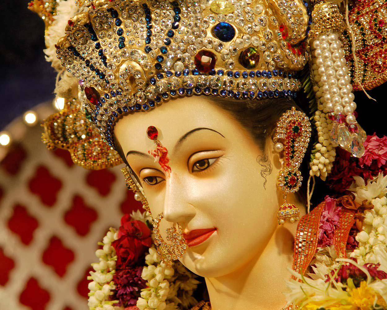 Divine Carving Of Vaishno Devi With Gem Bindhi Wallpaper